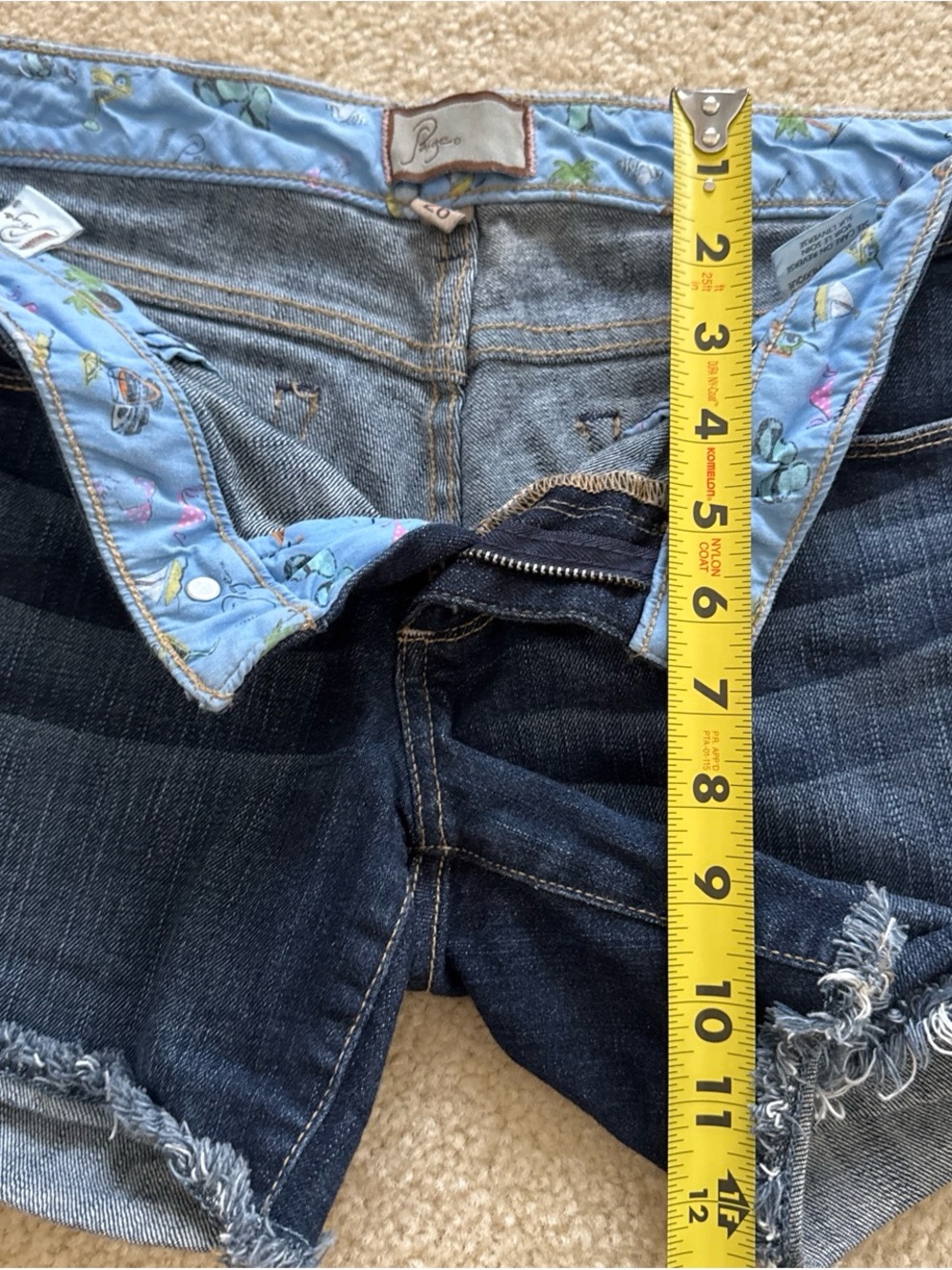 PAIGE Dark Indigo Denim Cutoff Shorts with Light Blue Printed Waistband